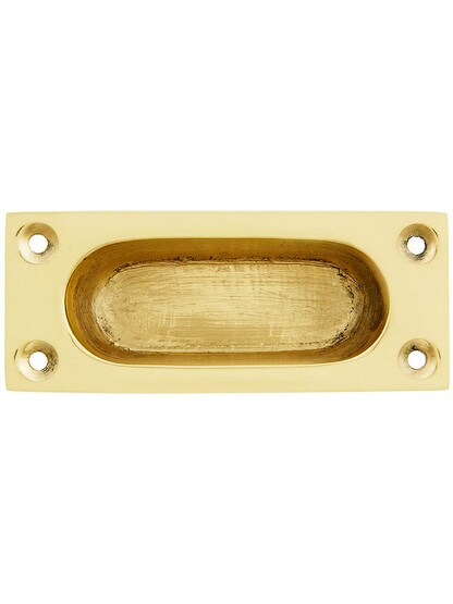 Cast Brass Flush Mount Sash Lift With Oval Inset In Polished Brass.